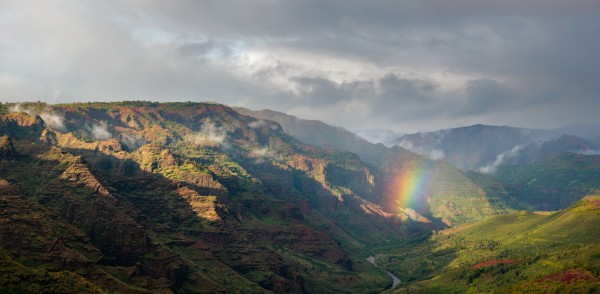rainbow over waimea canyon in kauai