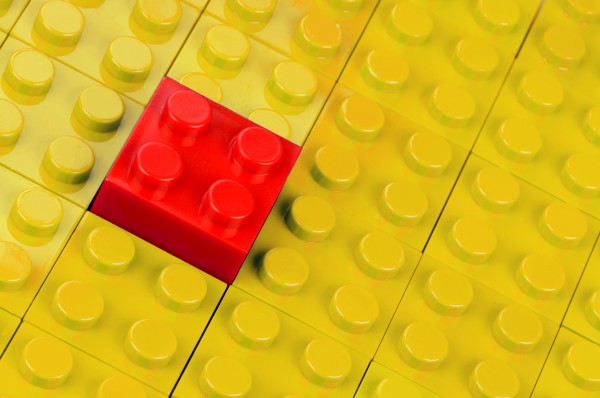 red building block inserted in yellow