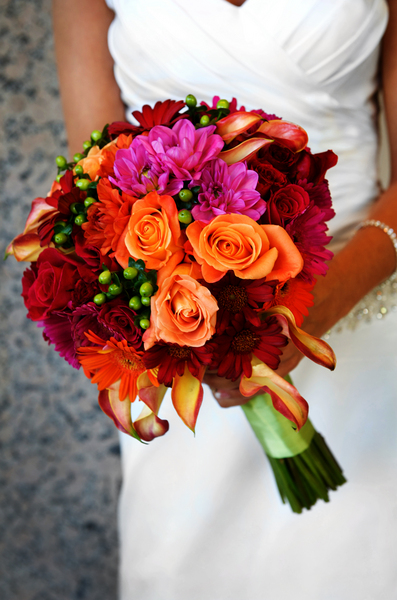 bride holding colorful large bouquet