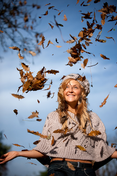 autumn woman with leaves falling