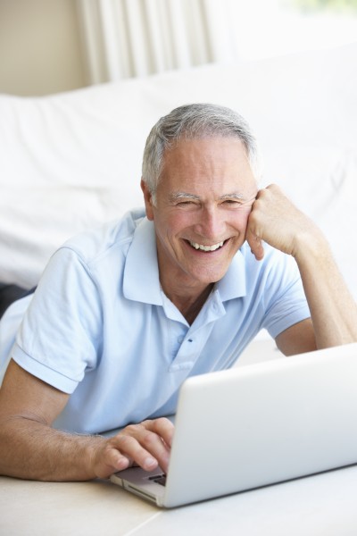senior man using laptop computer
