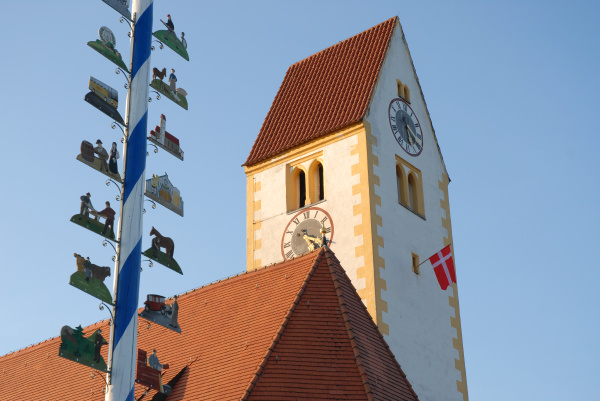 maypole with church tower