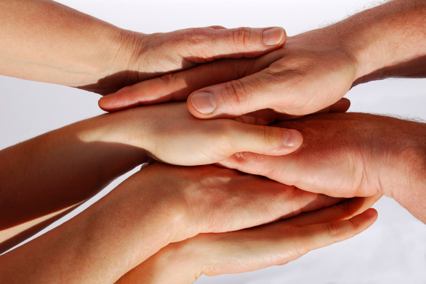 many hands symbolizing unity and teamwork