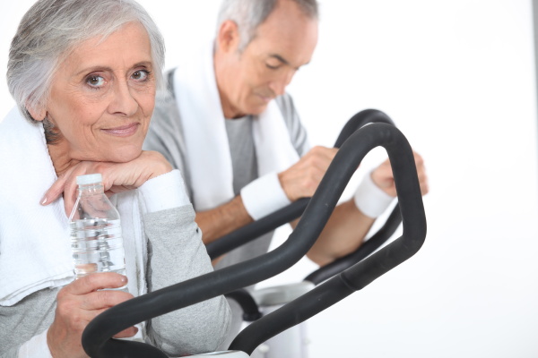 couple exercising together at the gym