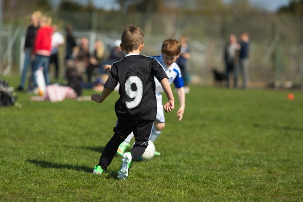 Two Boys Playing Soccer - Stock Photo #11600719 