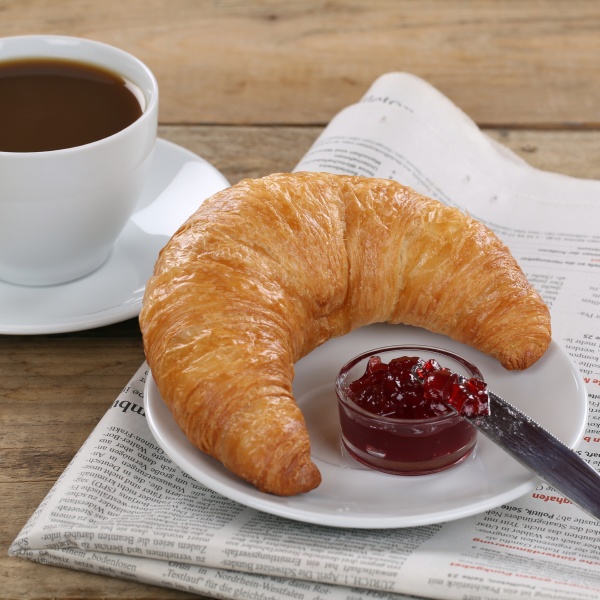 business breakfast croissant with jam coffee