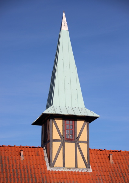 half timbering tower with verdigris roof