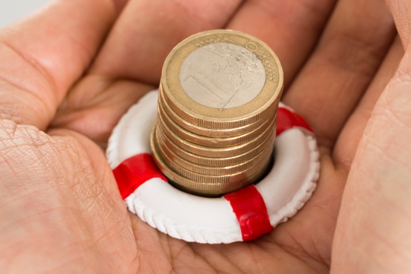 person holding coins and lifebelt