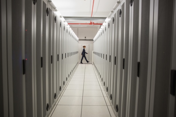 technician walking in server hallway