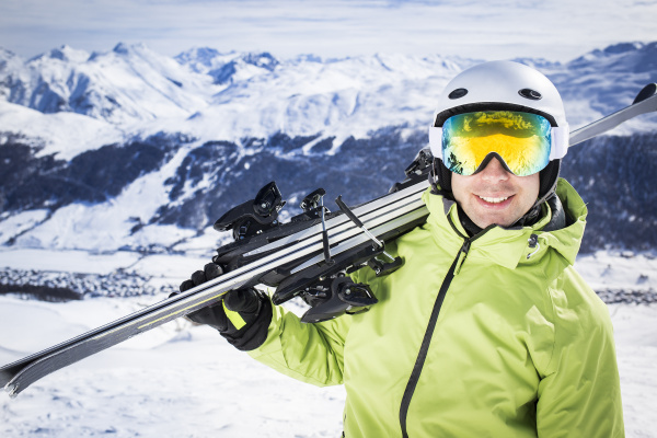 young successful men ski mountain winter