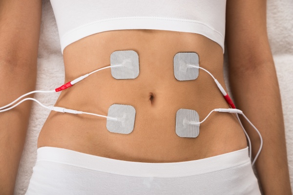 woman with electrodes on her stomach