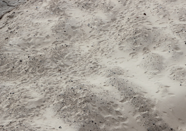 sand dune with unstructured footprints in