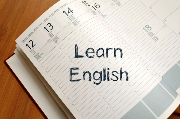learn english write on notebook