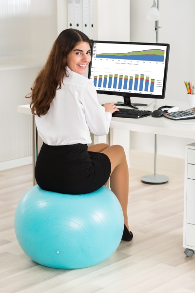 businesswoman using computer while sitting on