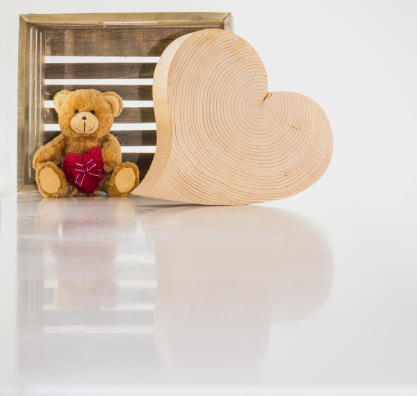 a teddy bear and a wooden