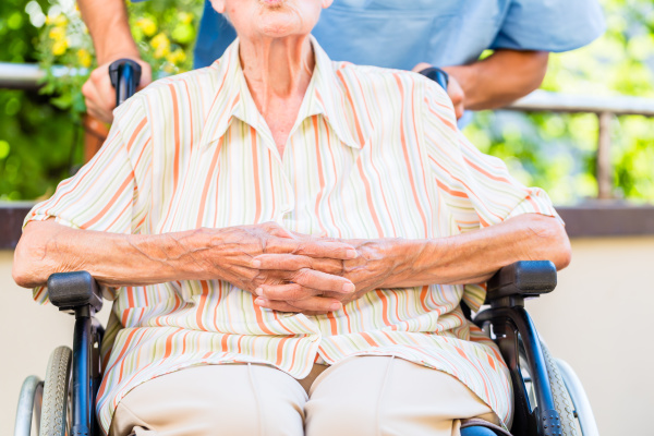 Elderly caregiver chats with senior woman in the home - Stock Photo ...