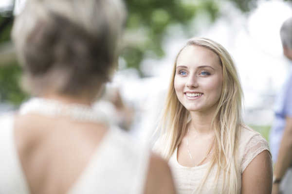 smiling young woman in a conversation