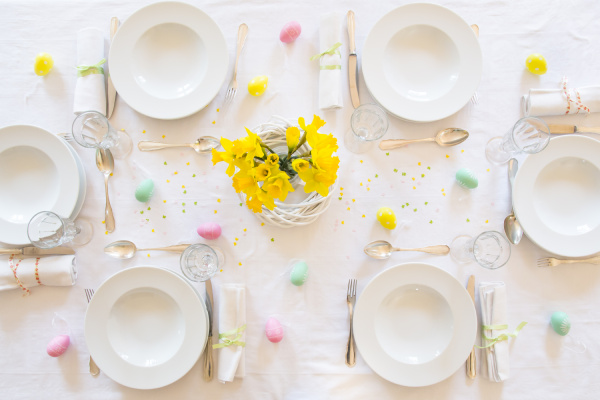 laid easter table with bunch of