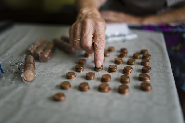 elderly woman counting money making