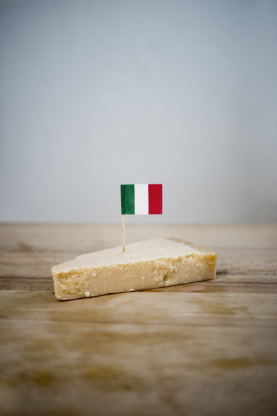 parmesan cheese with small italian flag