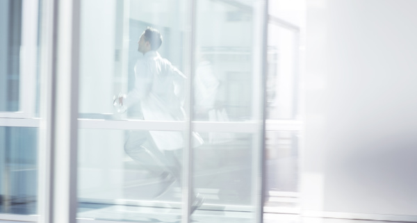 doctor running in hospital corridor