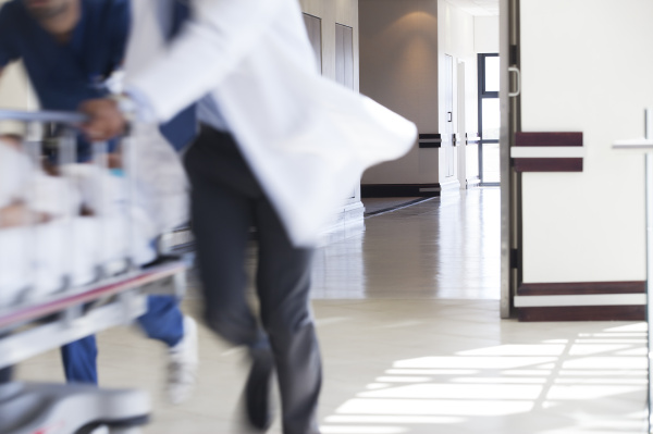 hospital staff rushing patient to operating