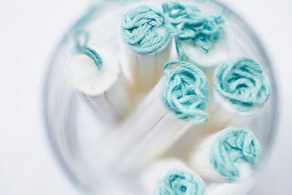 close up of tampons in glass