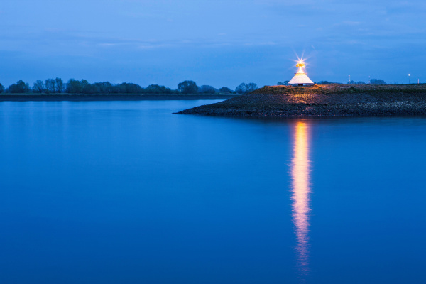 monument by river lit up at