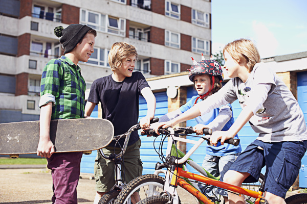 group of boys talking with bikes
