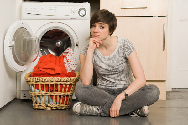 young woman by washing machine