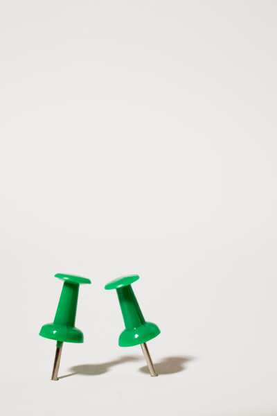 two green thumbtacks
