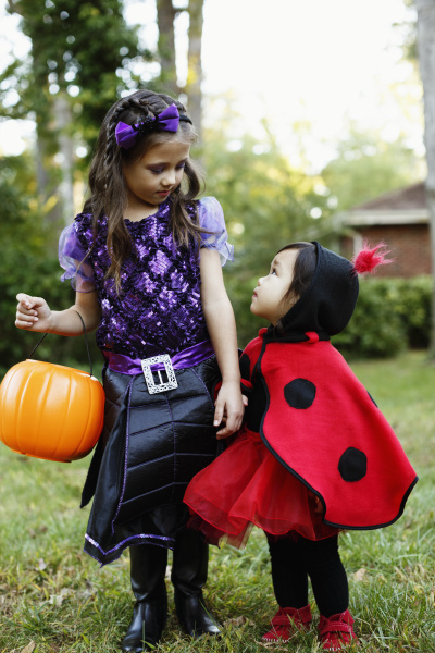 two girls with trick or treat
