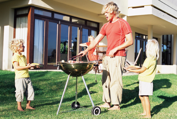 father doing a barbecue for his