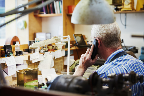a clock maker on the telephone