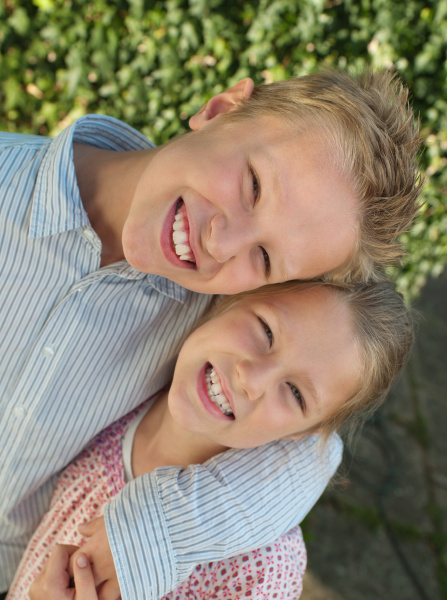 brother and sister smiling portrait