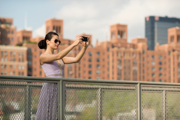 mid adult women photographing in new