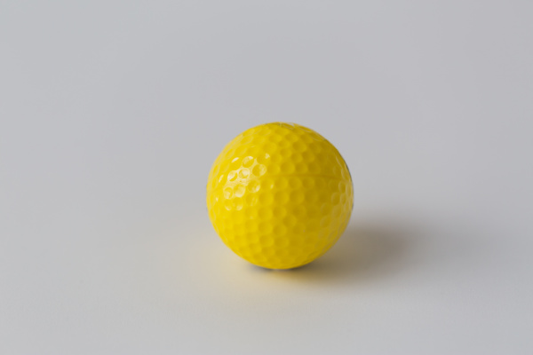 close up of yellow golf ball