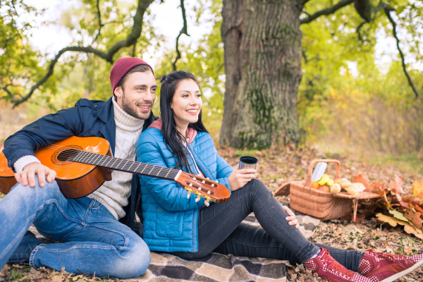 romantic couple in autumn forest