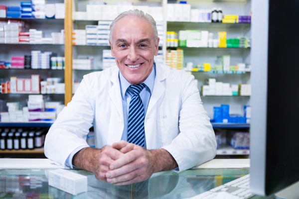 pharmacist sitting at counter