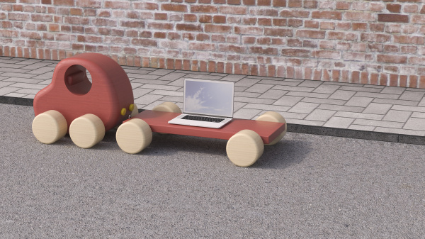 laptop on trailer of wooden toy