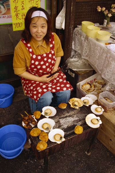 portrait of a woman selling shellfish