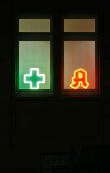 illuminated pharmacy signs close up