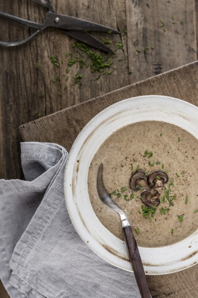thick and creamy mushroom soup garnished