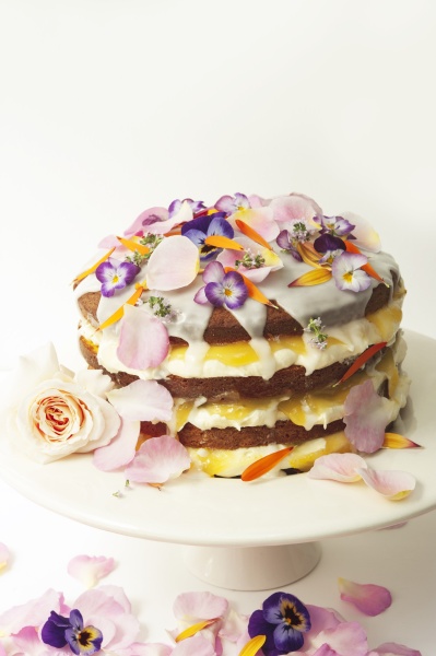 layered lemon drizzle cake decorated with
