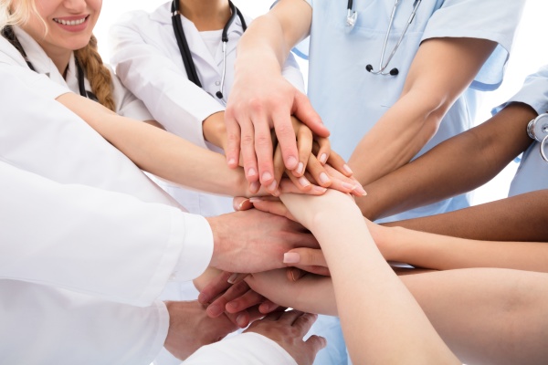 group of doctors stacking their hands