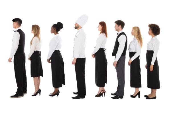 multiracial restaurant staff standing in row