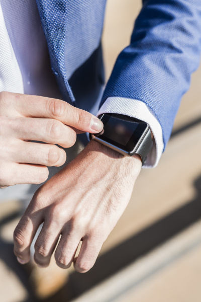 close up of businessman with smartwatch