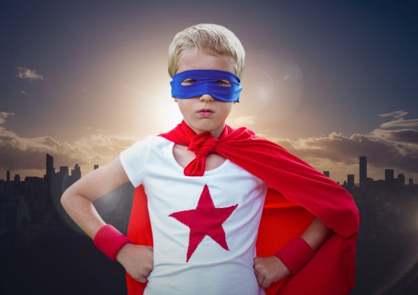 Boy in superhero costume hands on his waist standing - Stock Photo ...