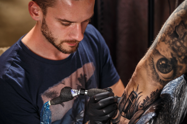 close up tattoo artist