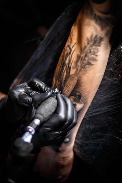 tattoo artist doing tattoos